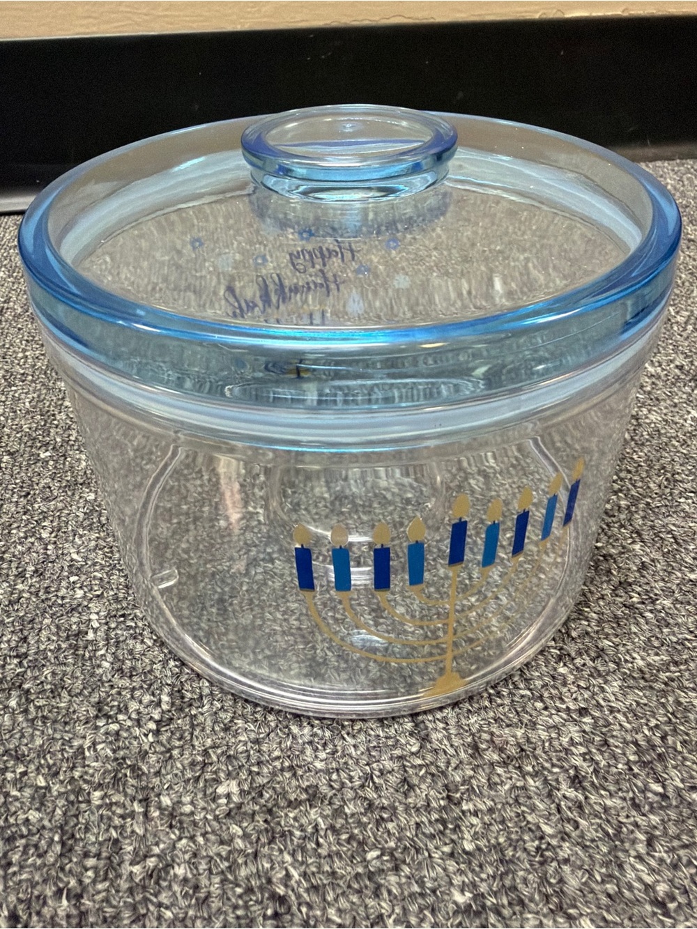 Clear Plastic container w/ Light Blue & Clear Lid. Hanukkah and menorah on jar.